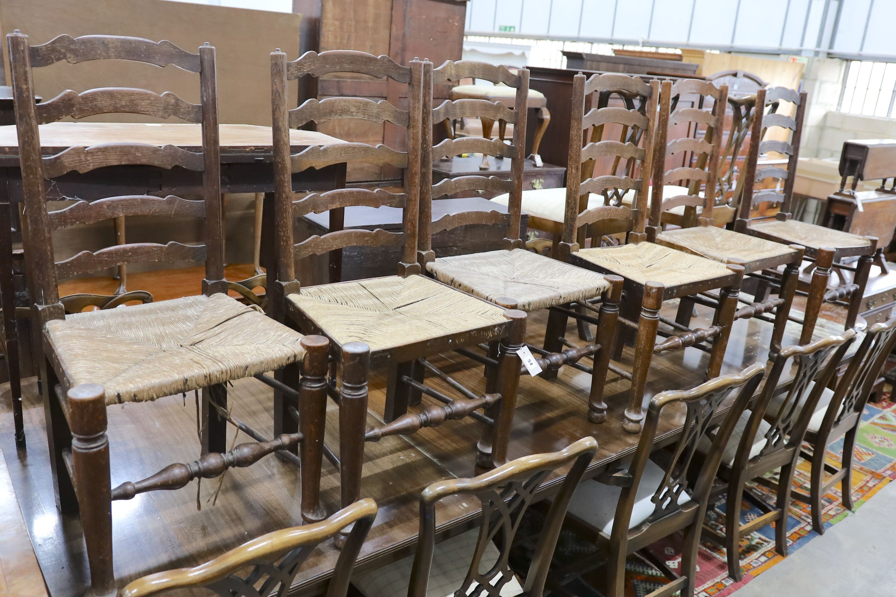 A set of six oak rush seat ladder back chairs